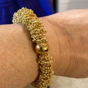 Bright gold diamond cut beaded bracelet with magnetic closure